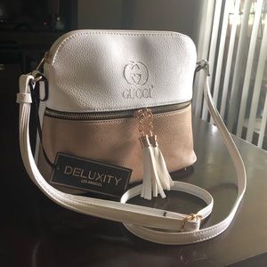 Light weight tasseled crosses body bag